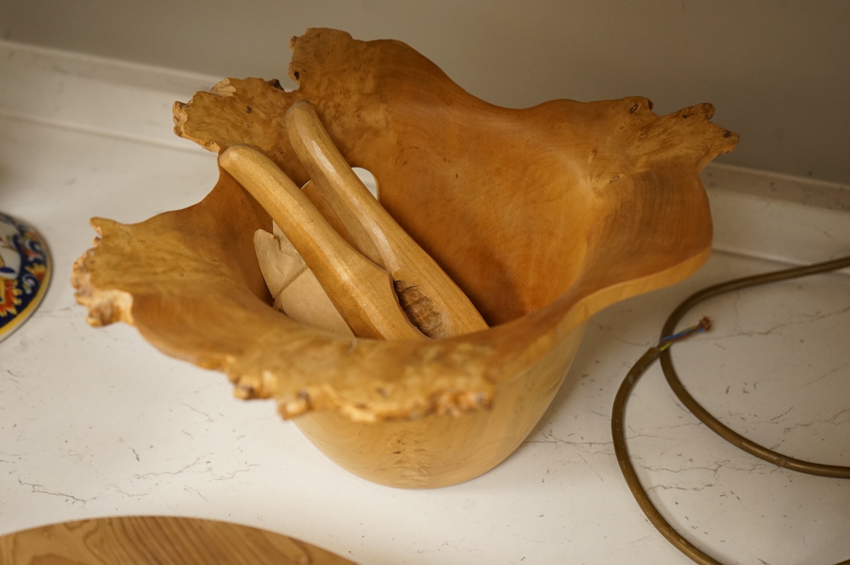 A modern treen yew bowl, a burr wood bowl and various fruit